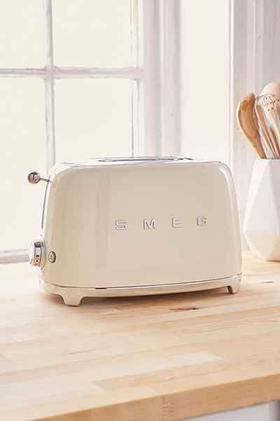 20 clever bridal shower gift ideas to be innovative 13 Bridal shower gift ideas featuring a cream smeg toaster on a butcher-block countertop, illuminated by soft morning light through a window.