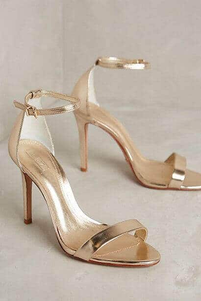 38 wedding accessories list - ideas to transform your big day into magic 19 Elegant rose-gold stiletto sandals with ankle straps and open toes, set on a soft ivory backdrop, perfect for a modern bride's wedding accessories.