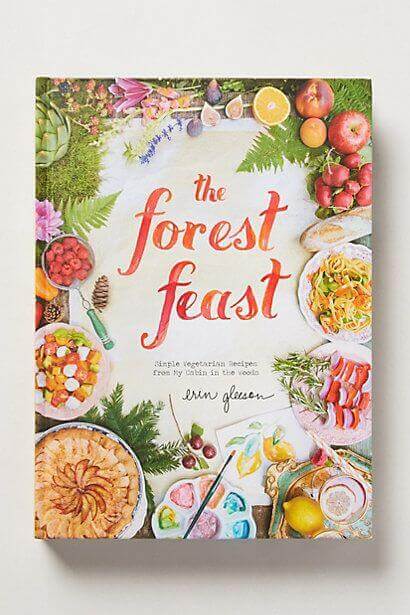 20 clever bridal shower gift ideas to be innovative 21 Colorful cookbook titled 'the forest feast' surrounded by vibrant fruits, vegetables, and vegetarian dishes on a light background.