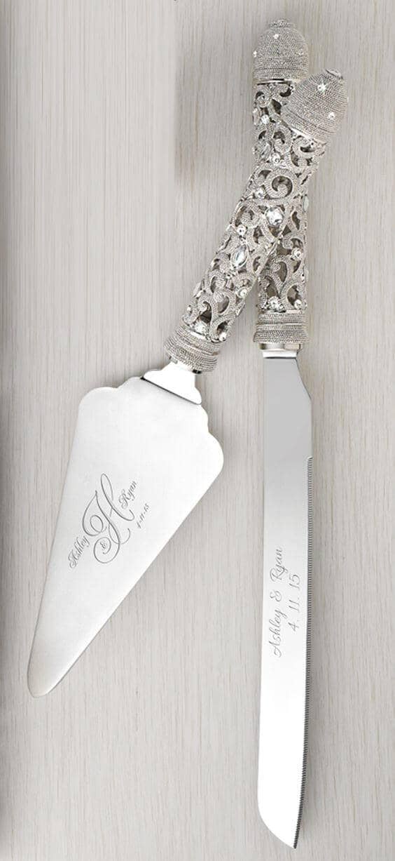 38 wedding accessories list - ideas to transform your big day into magic 35 Ornate wedding accessories featuring a luxurious cake knife and server with engraved stainless blades, silver filigree handles, and crystal accents.